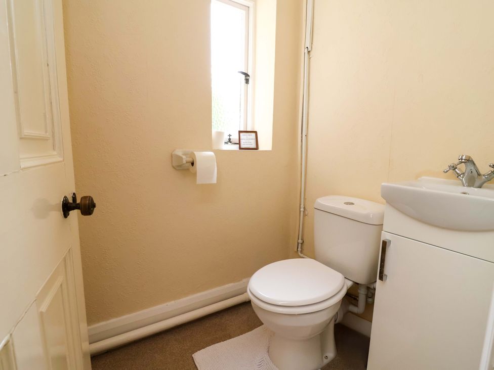 A bathroom with a toilet and sink at Parkfields House Tittensor near Barlaston