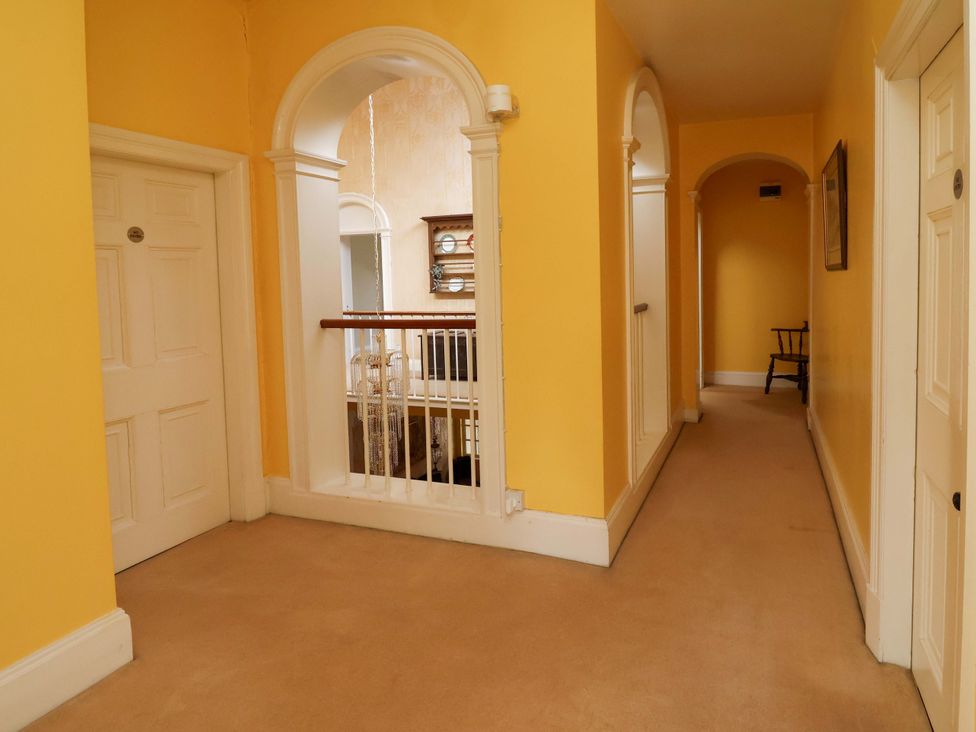 A hallway with doors and a staircase at Parkfields House Tittensor near Barlaston