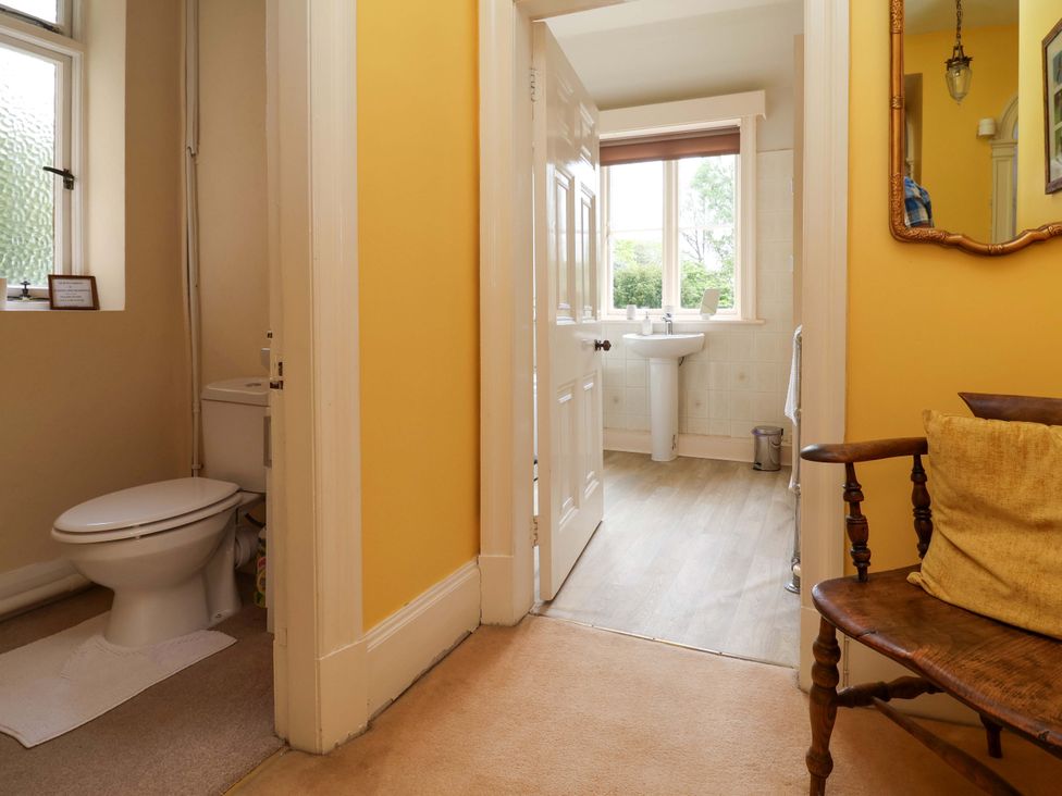 A bathroom with a toilet and sink at Parkfields House Tittensor near Barlaston