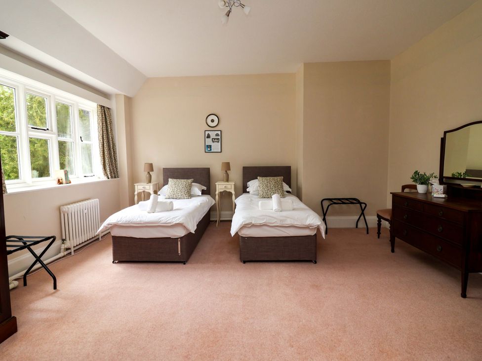 A bedroom with two single beds and a dresser at Parkfields House Tittensor near Barlaston