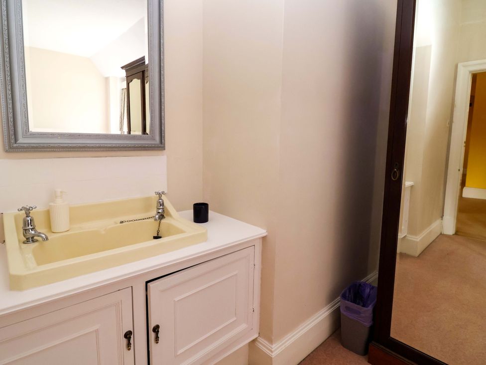 A bathroom with a sink and mirror at Parkfields House Tittensor near Barlaston