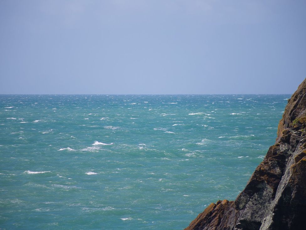 A view of the ocean and rocky coastline at Daphne in Mullion