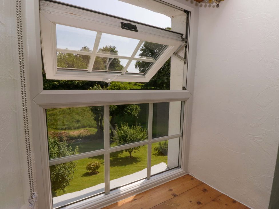 A window with outdoor view at Burnbank Cottage in Grange-Over-Sands