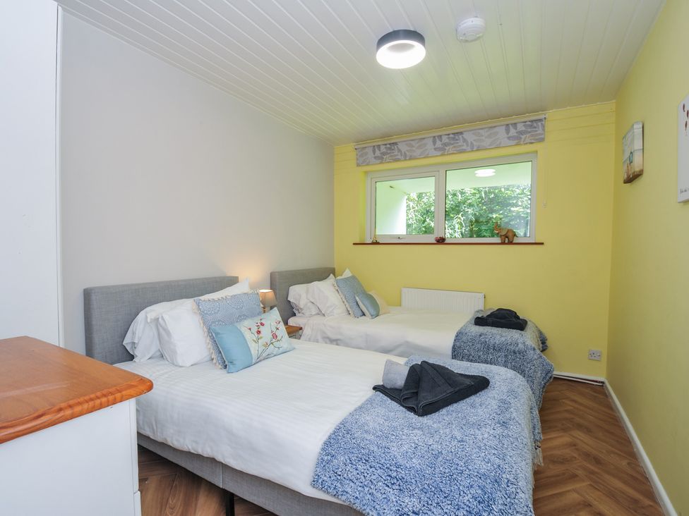 A bedroom with two beds and a window at 37 Tamar St Ann's Chapel near Callington