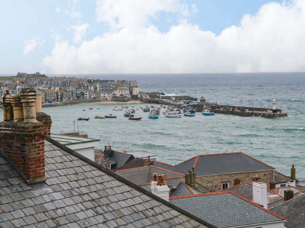 A harbor with boats and buildings at Harbour View in St Ives