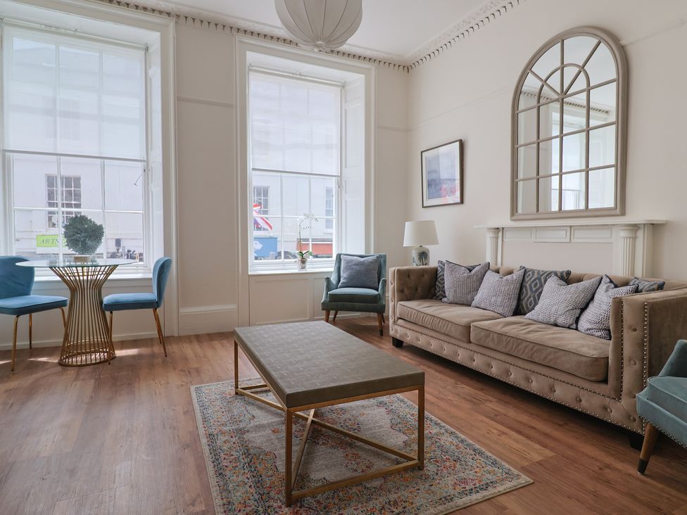A living room with a sofa and coffee table at FLAT 1 53a Broad Street (1 Bedroom Sleeping 2) Lyme Regis