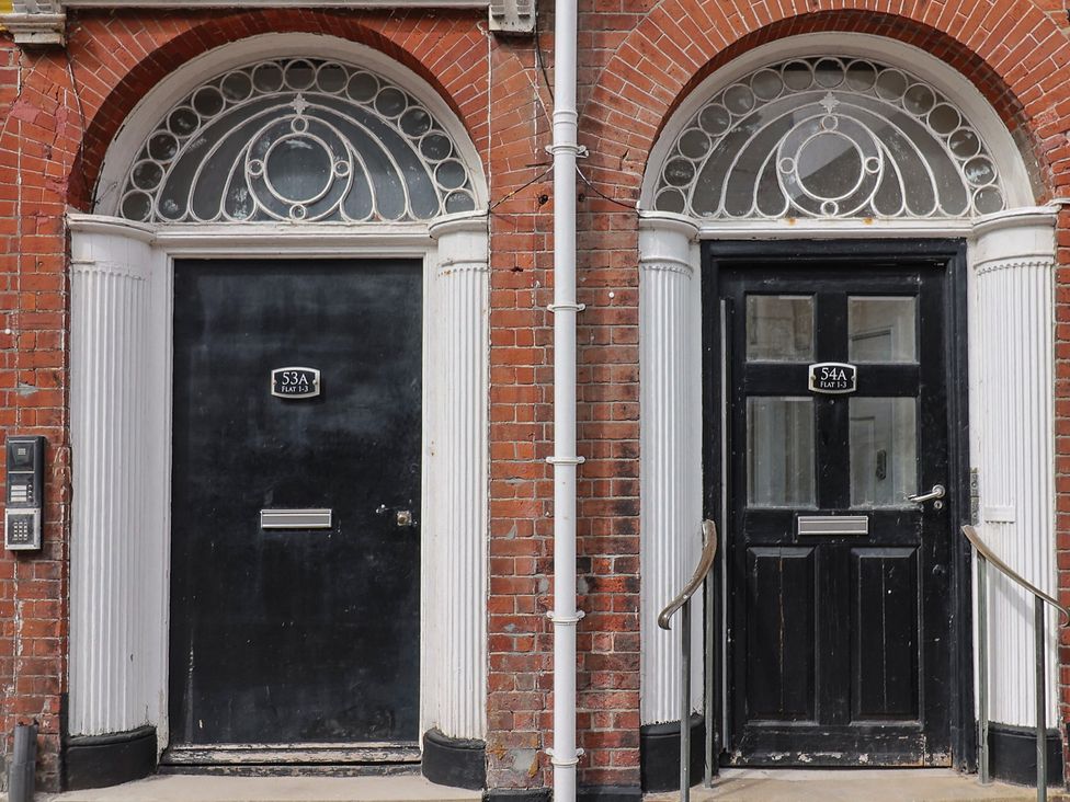 Two front doors with mail slots and doorbells at FLAT 1 53a Broad Street (1 Bedroom Sleeping 2) Lyme Regis