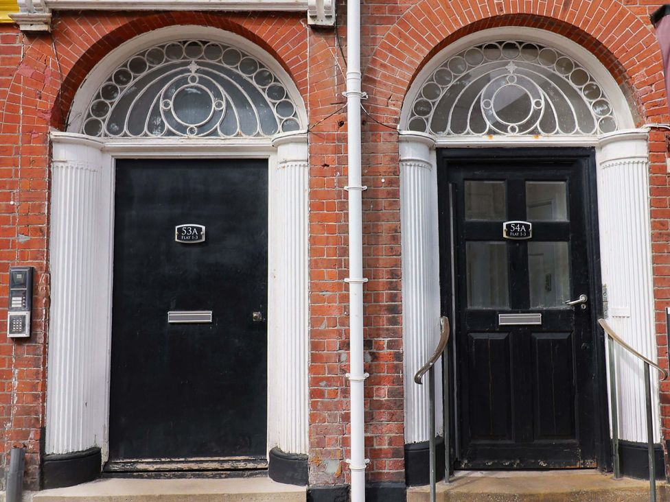 Two doors with numbers 53A and 54A at Pebble Cove, Lyme Regis