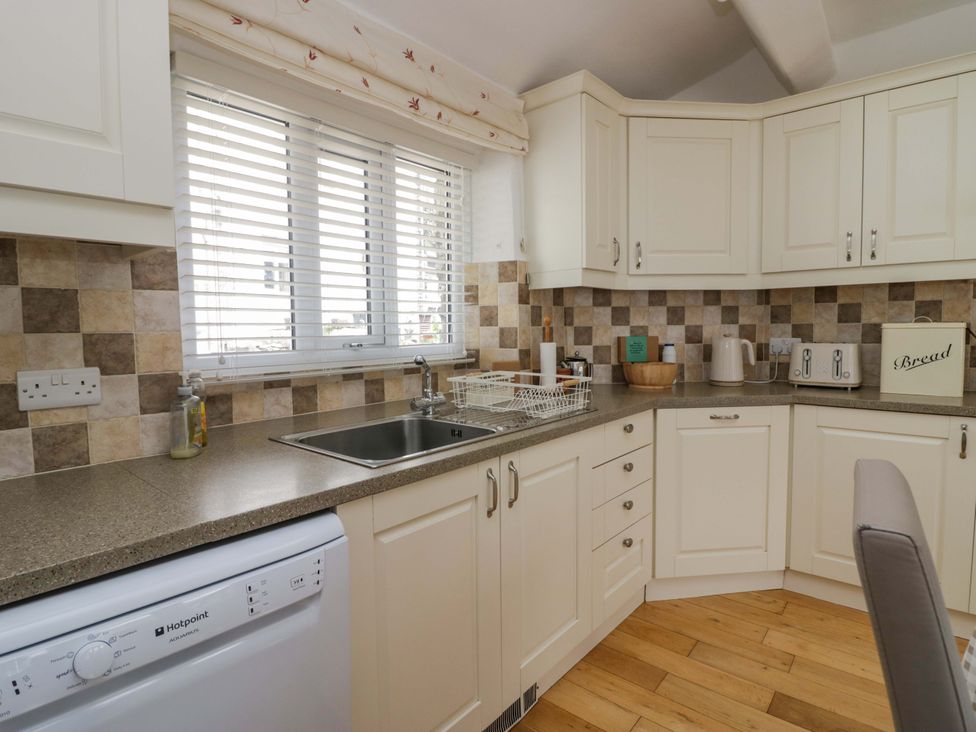 A kitchen with a sink and countertop at Hollens Cottage in Grasmere