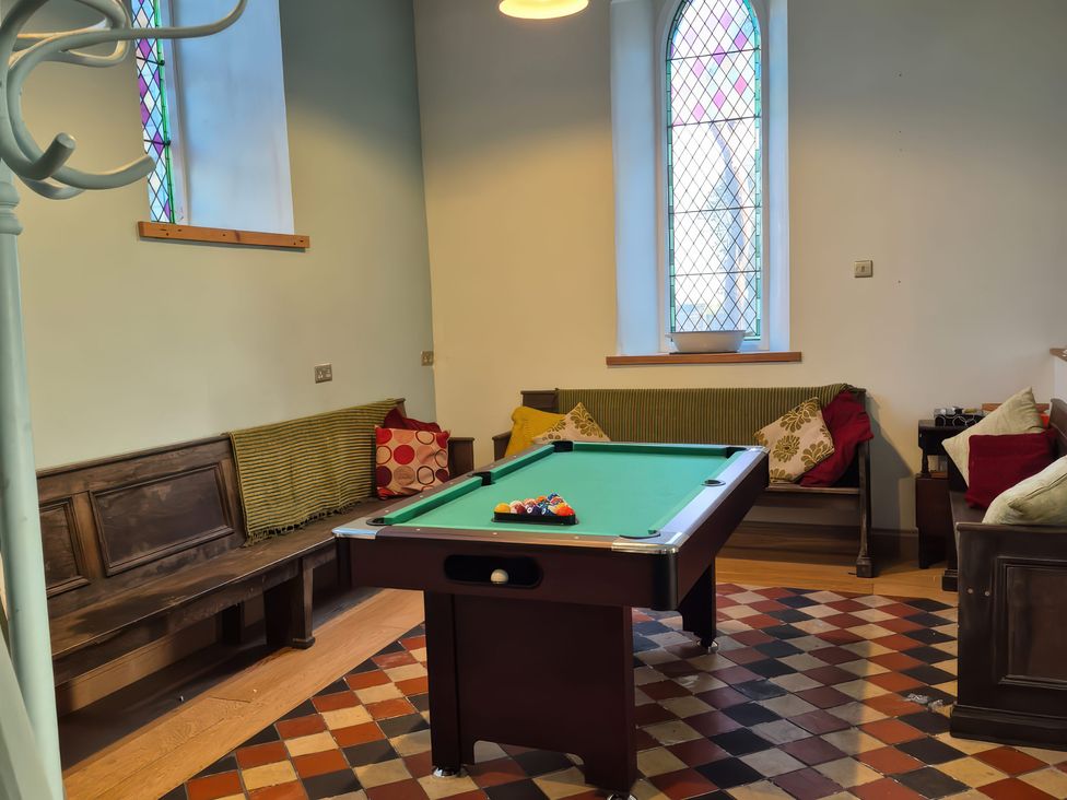A snug with a pool table and seating at Church Llygad Y Dyffryn in Sarnau near Brynhoffnant