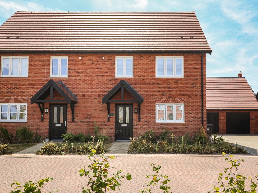 A brick house with two entrances and a garden at Inishnee House in Shotley Gate