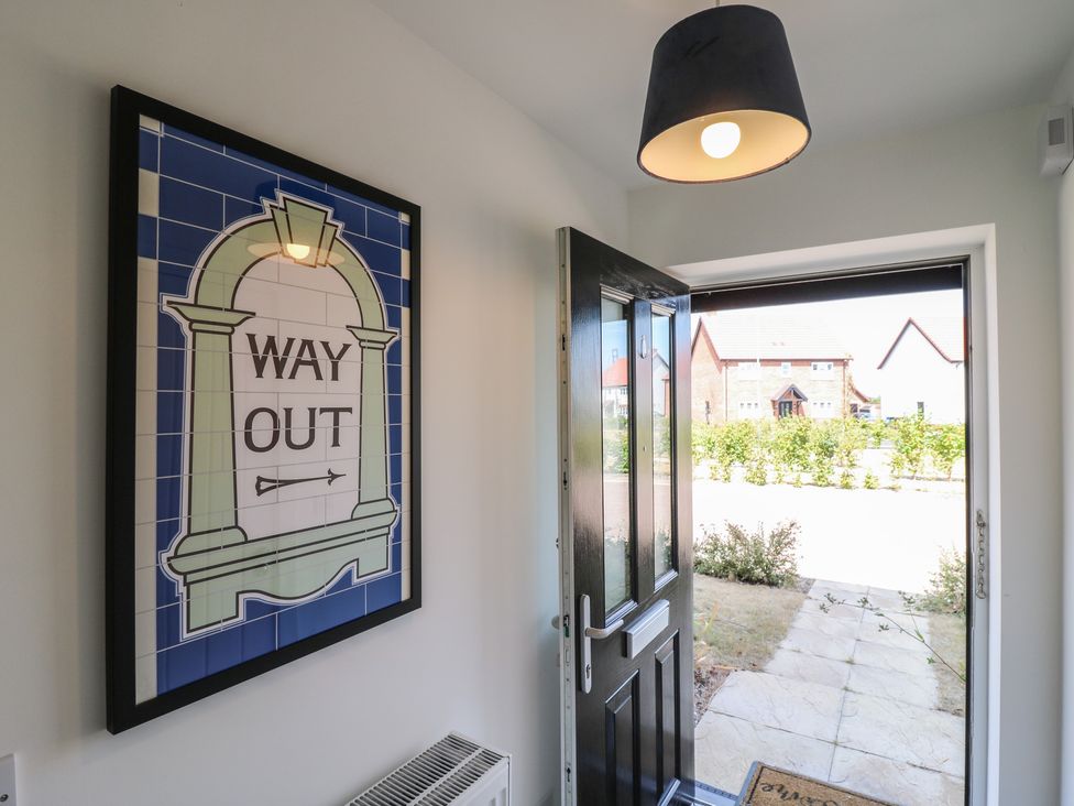 An entrance with a door and a sign at Inishnee House in Shotley Gate