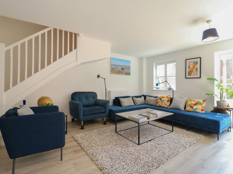 A living room with a sofa and armchairs at Inishnee House in Shotley Gate