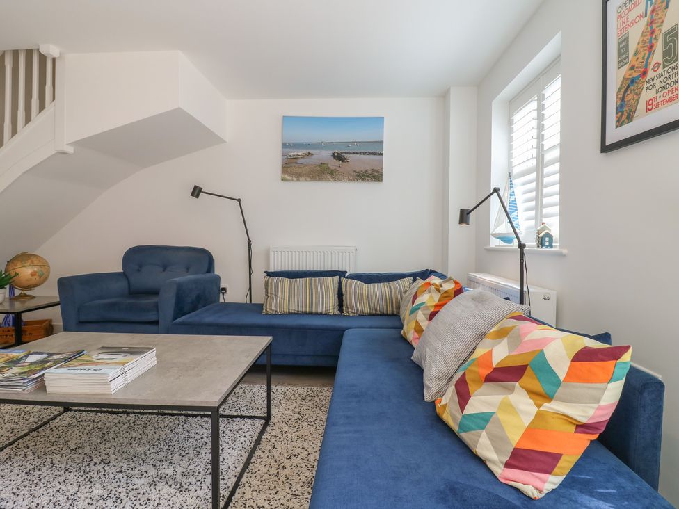 A living room with a sofa and coffee table at Inishnee House in Shotley Gate