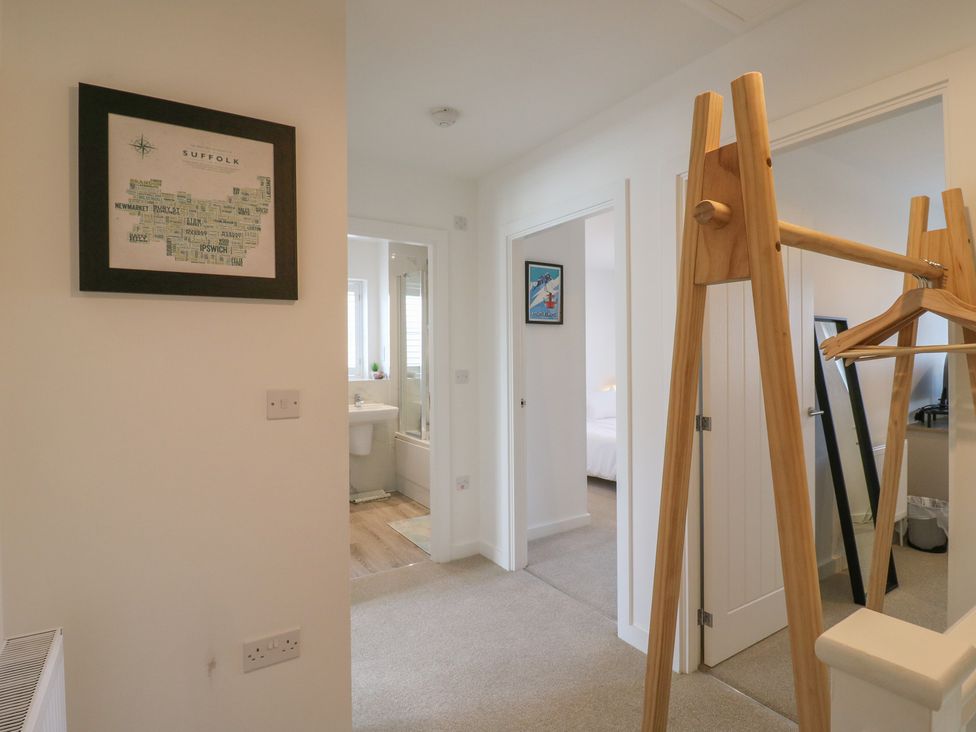 A hallway with a map on the wall at Inishnee House in Shotley Gate
