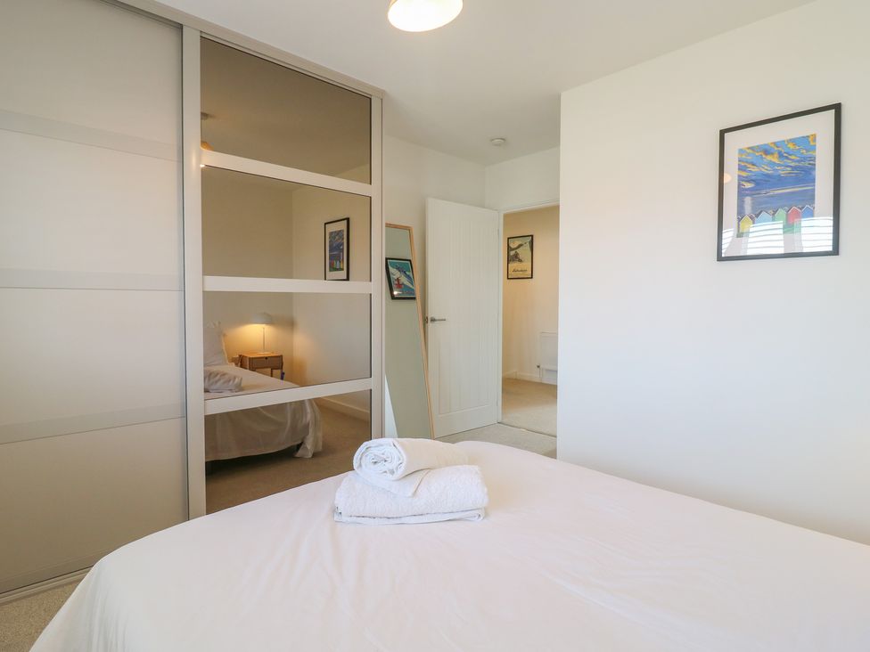 A bedroom with a bed and bedside table at Inishnee House Shotley Gate