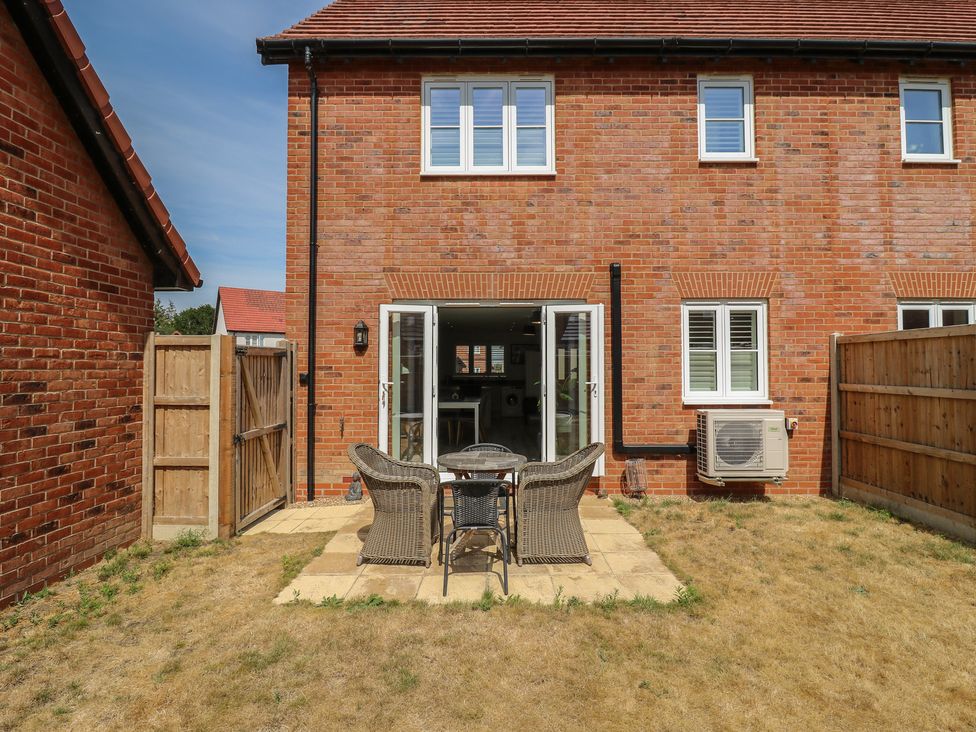 A garden with a patio and table and chairs at Inishnee House in Shotley Gate