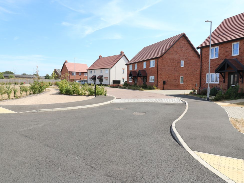 An outdoor view of residential houses along a circular road at Inishnee House in Shotley Gate