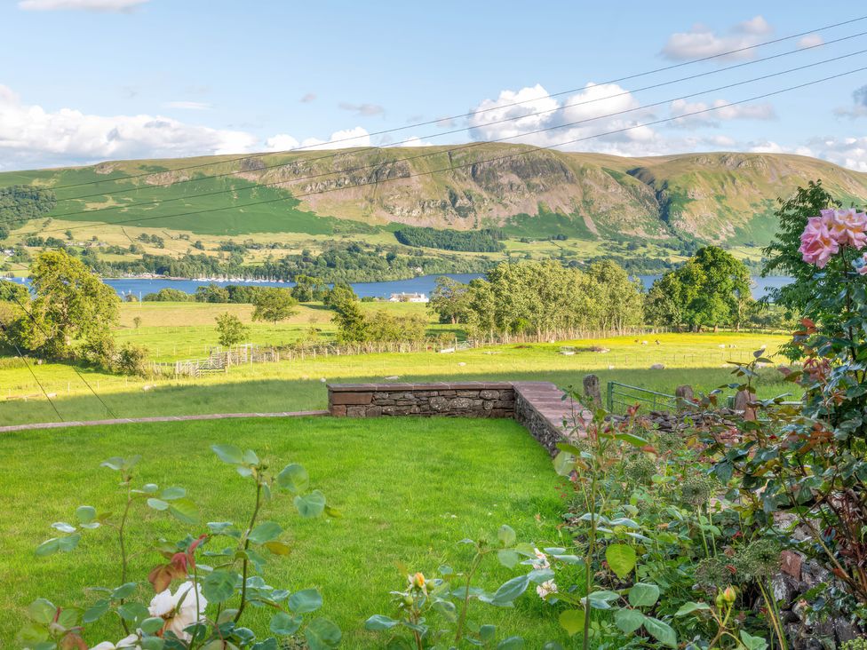 A scenic view of hills and a lake at Bank Barn, Wreay Watermillock