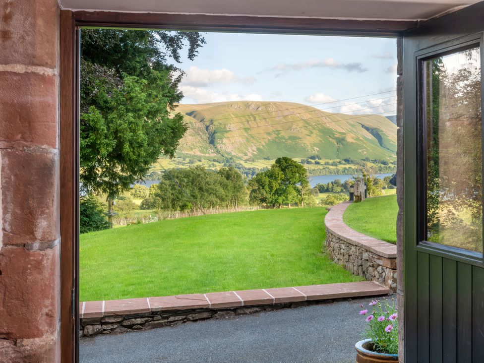 A view from a doorway showing grass and hills at Bank Barn, Wreay Watermillock
