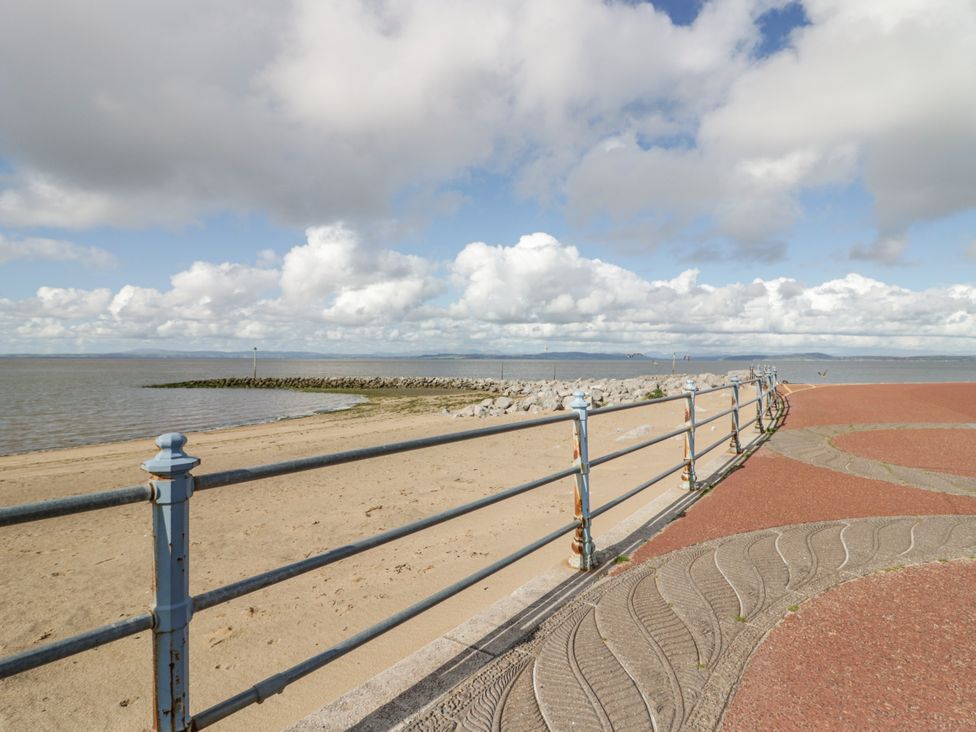 A walkway by the sea at Cockle Bay Cottage Heysham
