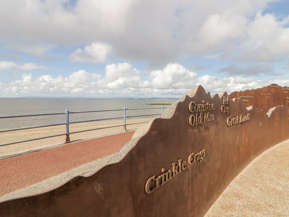 A coastal view with signs showing mountain names at Cockle Bay Cottage in Heysham