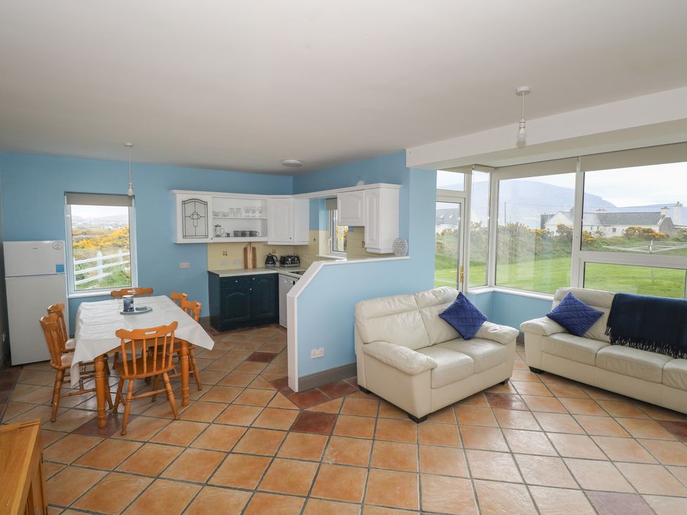 A living room with a dining area and kitchen at No.5 Beach Cottages, Keel, County Mayo