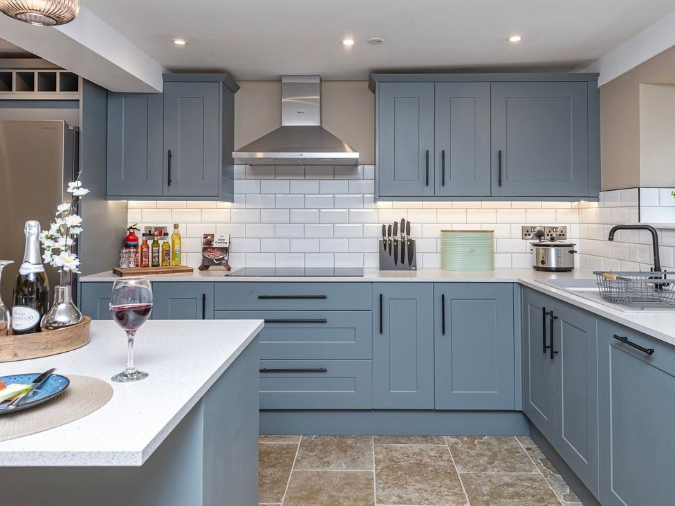 A kitchen with cabinets and a counter at Snowdonia Manor in Dolgellau