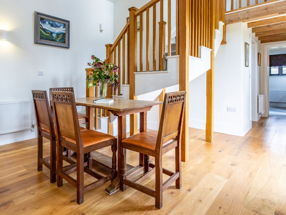A dining room with a table and chairs at Johnsons Smallholding in Market Drayton