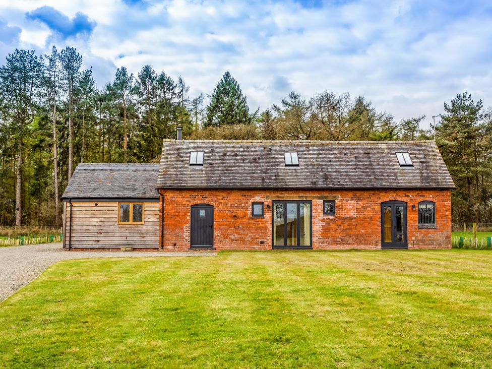 A house with brick and wooden exterior at Johnsons Smallholding Market Drayton