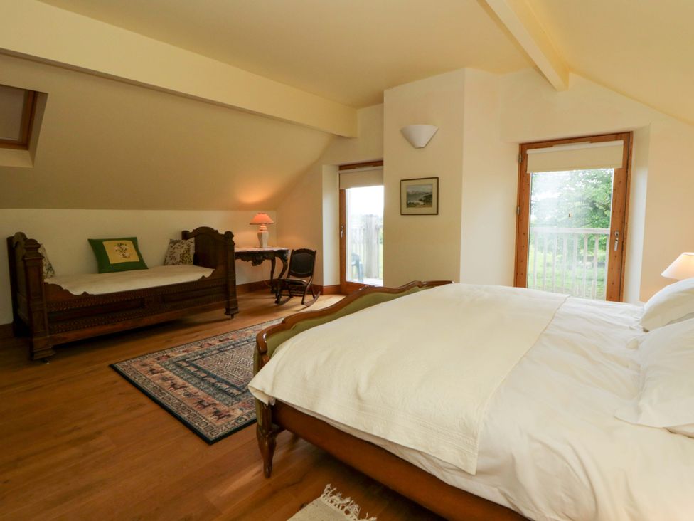 A bedroom with a bed and day bed at Bryn Isaf in Swyddffynnon near Pontrhydfendigaid