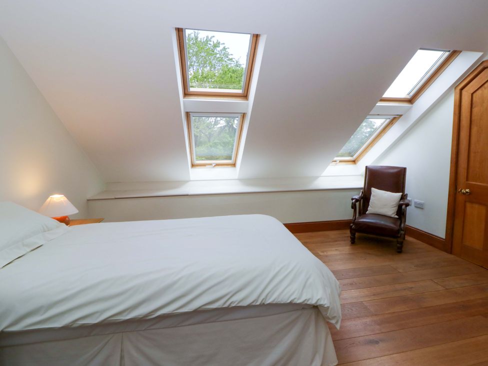A bedroom with a bed and skylights at Bryn Isaf in Swyddffynnon near Pontrhydfendigaid