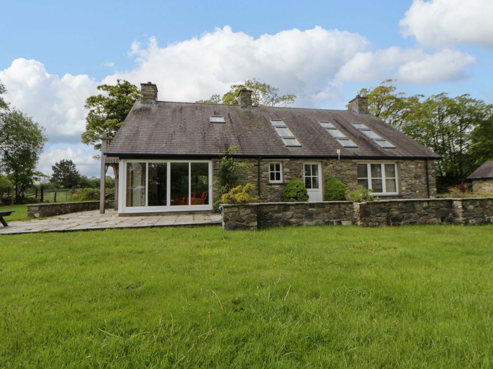 A house with a garden and trees at Bryn Isaf in Swyddffynnon near Pontrhydfendigaid