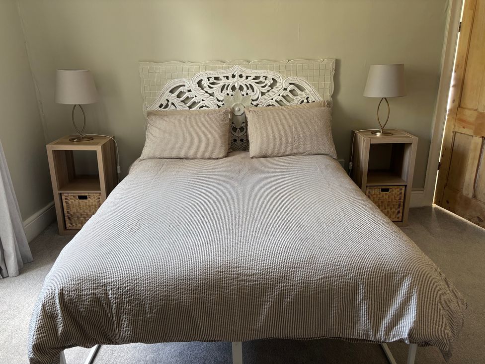 A bedroom with a bed and bedside tables at Humphreston House in Temple Cloud