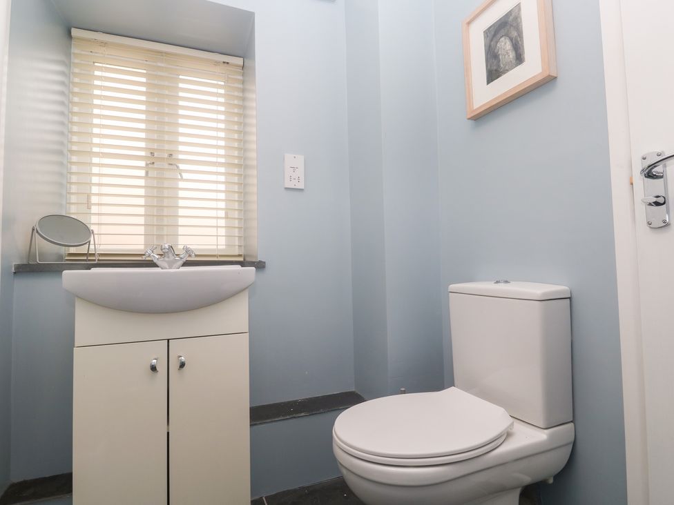 A bathroom with a sink and toilet at Mys Hedra Farm in St Buryan