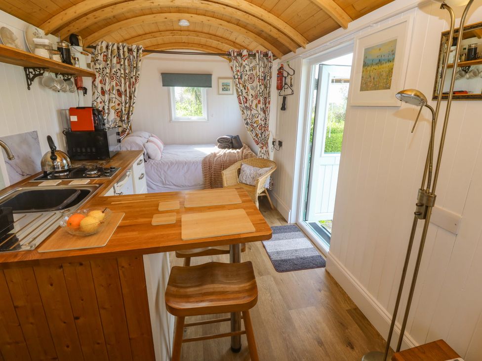 A studio with kitchen counter and bed at Higher Merther Farm Shepherds Hut Helston