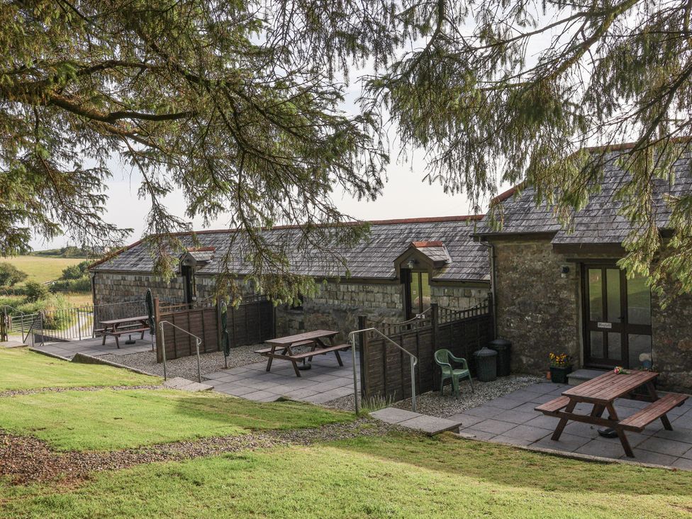 Outdoor area with tables and benches at The Dairy Common Moor near Liskeard