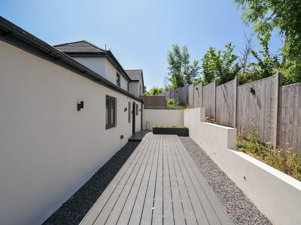 An outdoor space with decking and planters at The Mooring in Northam
