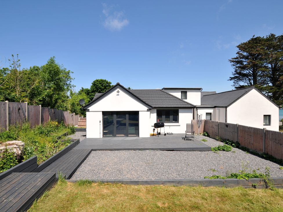 An outdoor area with a house and patio at The Mooring in Northam