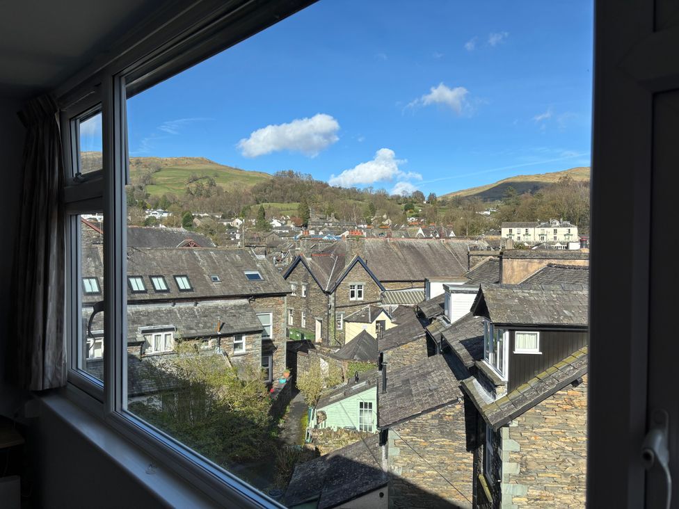 A view of rooftops and mountains at Rothay Cottage in Ambleside