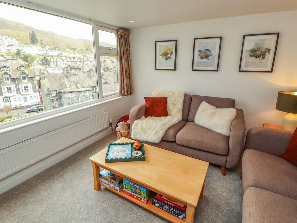 A living room with a sofa and coffee table at Rothay Cottage Ambleside