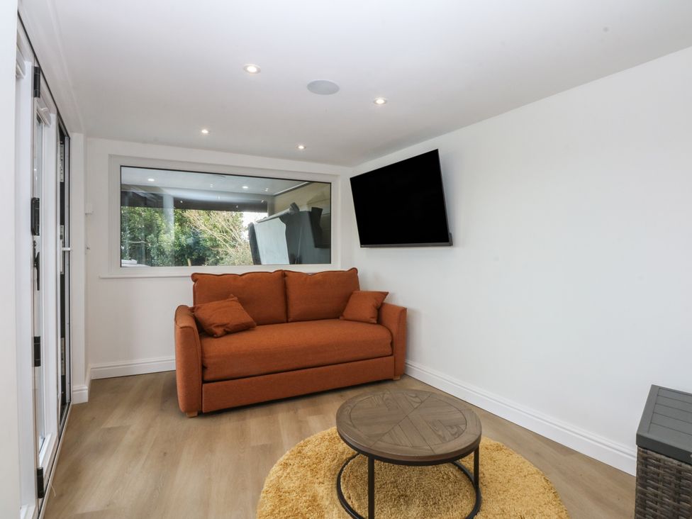 A living room with a couch and coffee table at The Bay in Benllech
