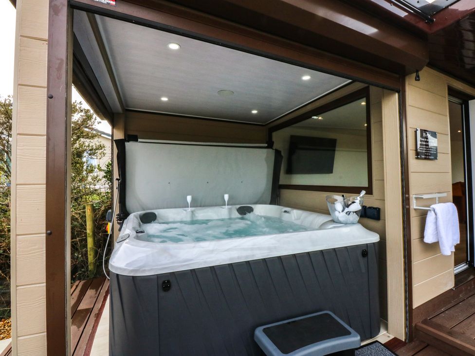 An outdoor area with a hot tub at The Bay in Benllech
