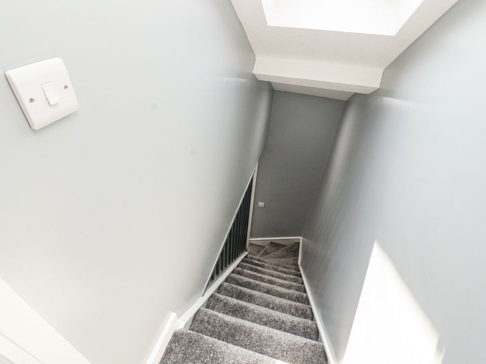 A staircase leading downward at 10 Keekle Terrace in Cleator Moor