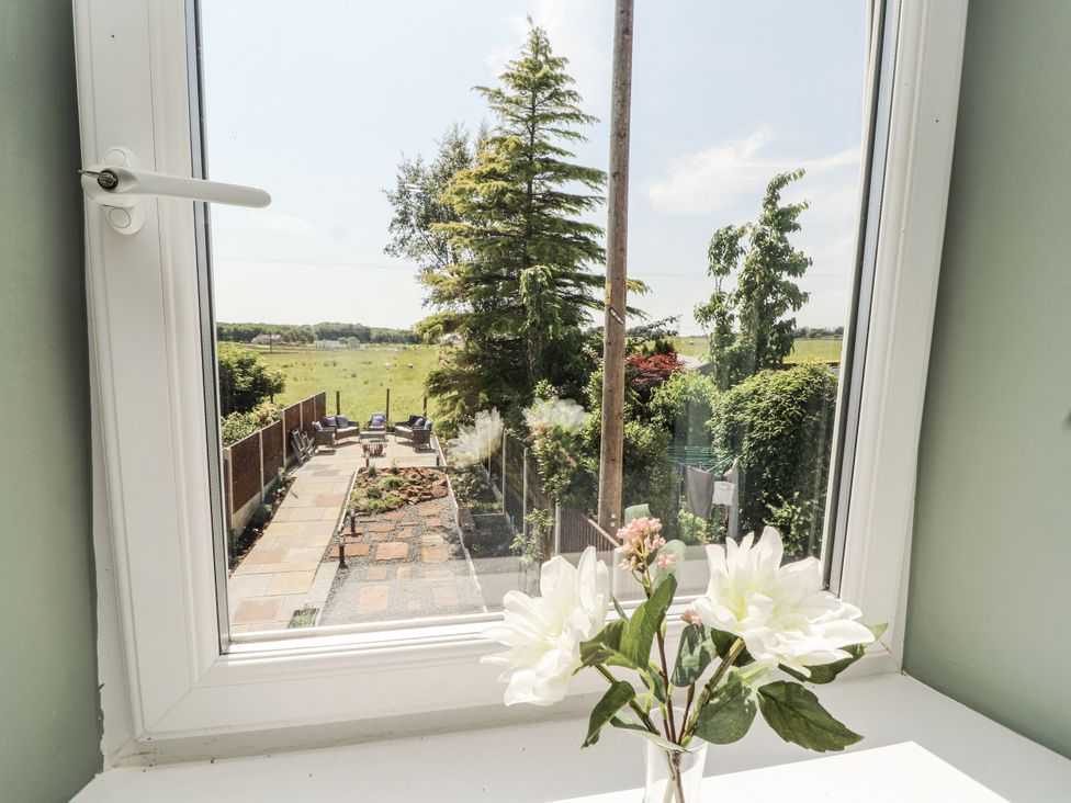 A view of a garden with flowers in a vase at 10 Keekle Terrace in Cleator Moor