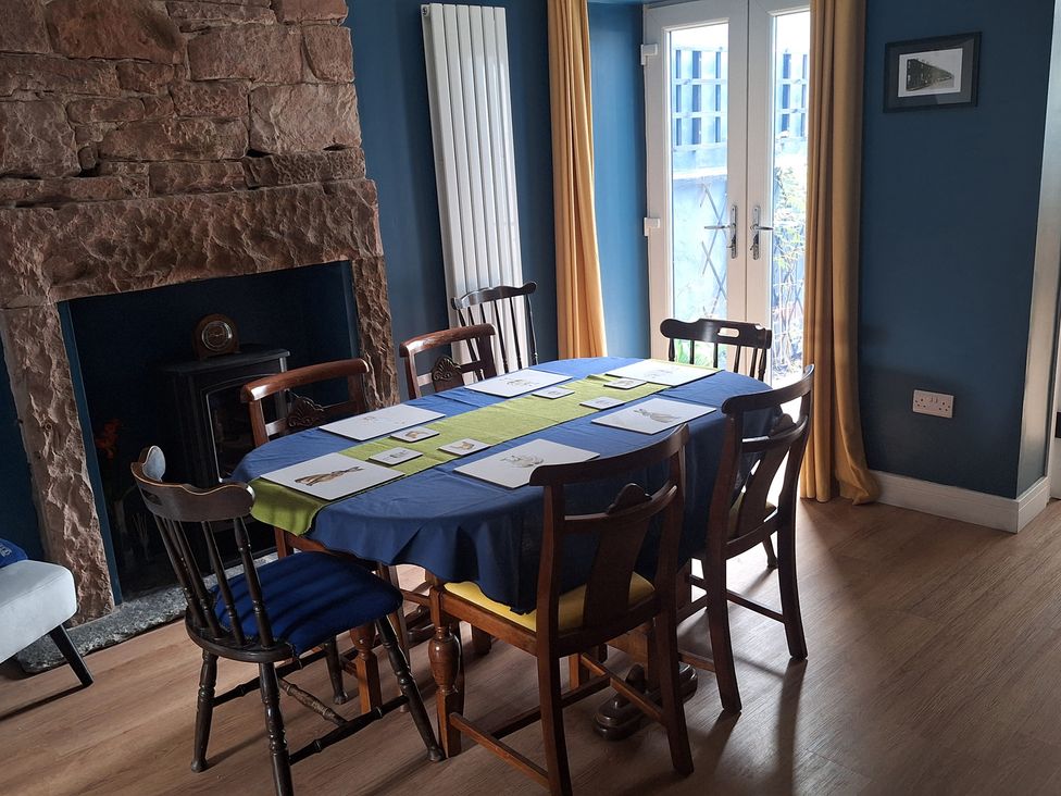 A dining room with a table and chairs at 10 Keekle Terrace in Keekle near Cleator Moor