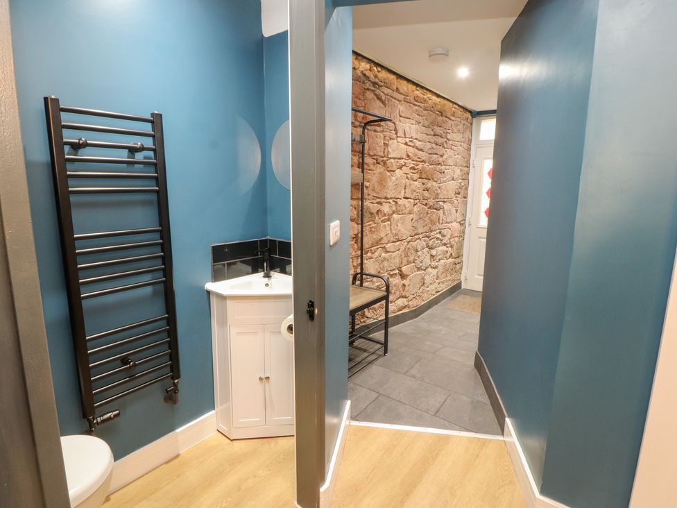 A bathroom with a toilet and hand basin at 10 Keekle Terrace in Keekle near Cleator Moor