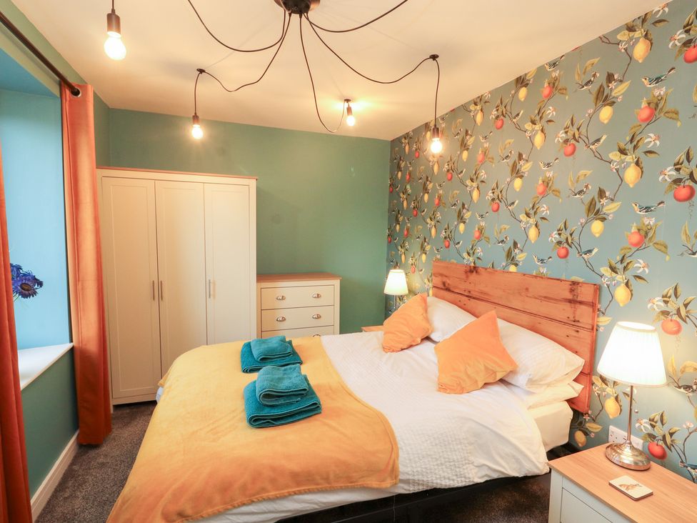 A bedroom with a bed and furniture at 10 Keekle Terrace in Keekle near Cleator Moor