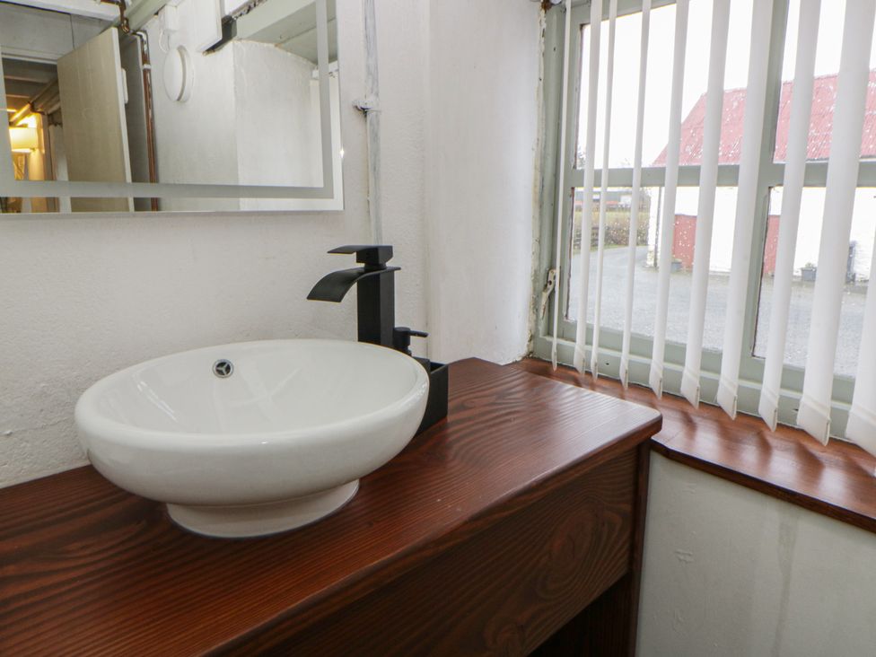 A bathroom with a sink and faucet at The Old Workshop in Dre-Fach near Lampeter