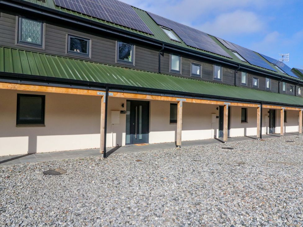An outdoor view of a building with solar panels at 25 Strathtay Lodges Aberfeldy